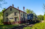 PAR 7552 leads a joint Pan Am / CSX inspection train past the former Boston & Maine depot in South Kingston, NH